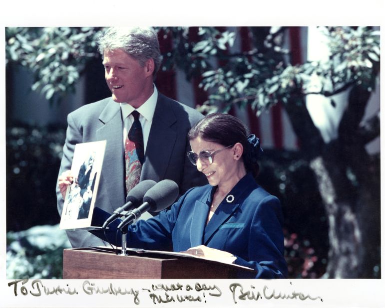 President Bill Clinton nominated Ginsburg to the US Supreme Court in June 1993. Here, Ginsburg is holding a photograph of Hillary Clinton singing "the toothbrush song" with Ginsburg's granddaughter Clara and her nursery school class. 