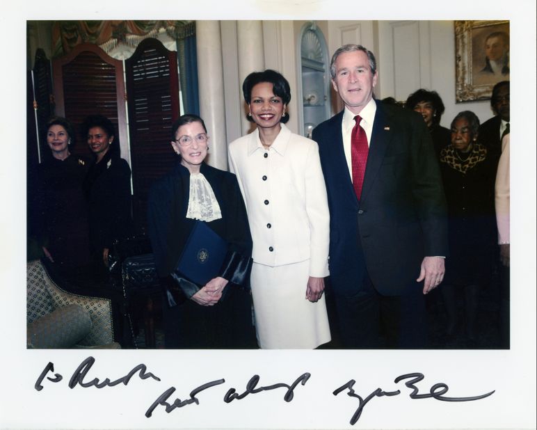Ginsburg stands with President George W. Bush and Secretary of State Condoleezza Rice at the Department of State in January 2005. Ginsburg had sworn in Rice that day.