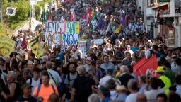 HENDAYE, FRANCE - AUGUST 24: Protesters march to protest against the annual G7 Summit, 30 kilometres (20 miles) south of the G7 gathering in Biarritz, on August 24, 2019 in Hendaye, France.  The French southwestern seaside resort of Biarritz is hosting the 45th G7 summit from August 24 to 26. High on the agenda will be the climate emergency, the US-China trade war, Britain's departure from the EU, and emergency talks on the Amazon wildfire crisis.   (Photo by Gari Garaialde/Getty Images)