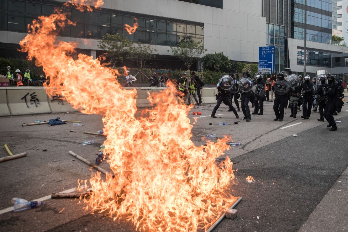 Police retreat after clashing with protesters after a rally in Kwun Tong in Hong Kong on Saturday. 