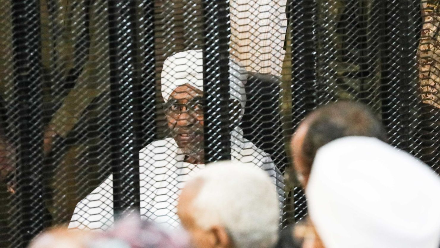 Sudan's ousted President Omar al-Bashir is seen inside the defendant's cage during his corruption trial in Khartoum on Saturday.
