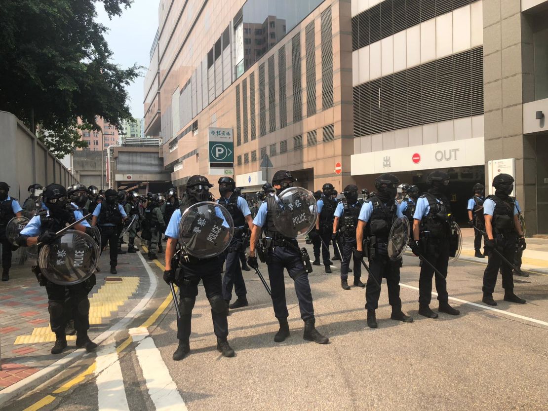 Police holding shields gather near a protest in Kwun Tong, Hong Kong, on August 24, 2019.