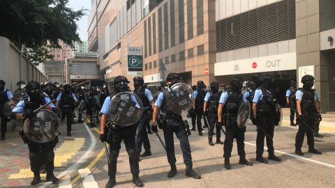 Police holding shields gather near a protest in Kwun Tong, Hong Kong, on August 24, 2019.