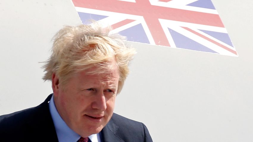 BIARRITZ, FRANCE - AUGUST 24: British Prime Minister Boris Johnson disembarks a plane as he arrives as Biarritz Pays Basque Airport for the G7 summit on August 24, 2019 in Biarritz, France. The French southwestern seaside resort of Biarritz is hosting the 45th G7 summit from August 24 to 26. High on the agenda will be the climate emergency, the US-China trade war, Britain's departure from the EU, and emergency talks on the Amazon wildfire crisis. (Photo by Dylan Martinez - Pool/Getty Images)