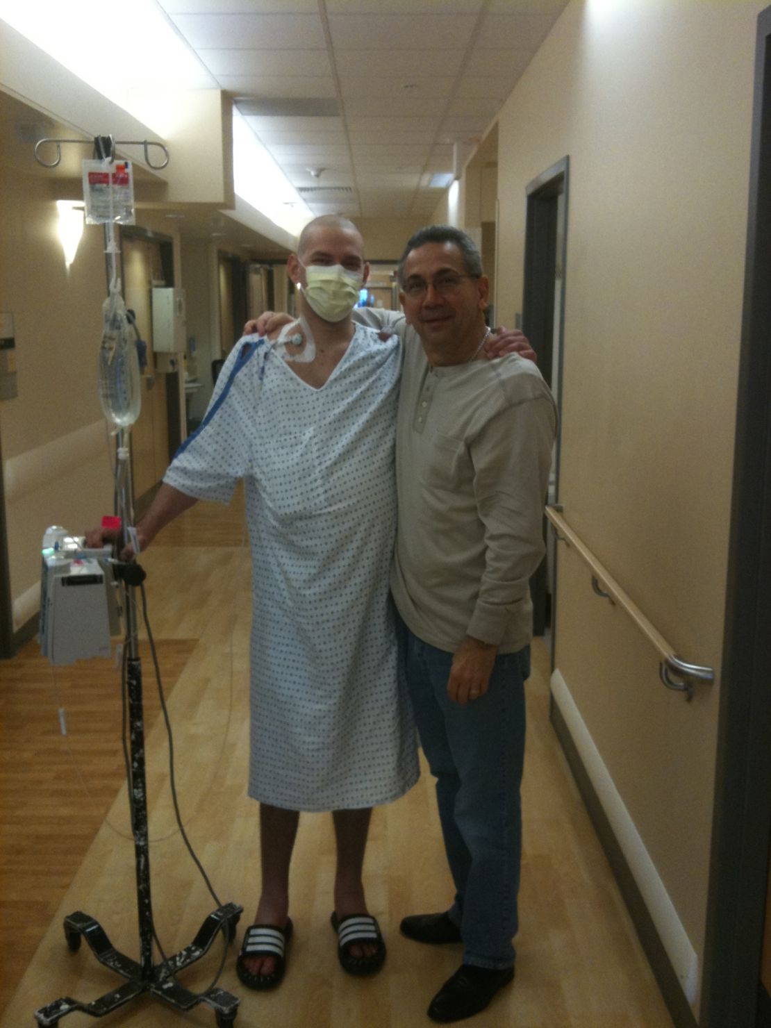 David Fajgenbaum poses with his father during one of his hospital stays.