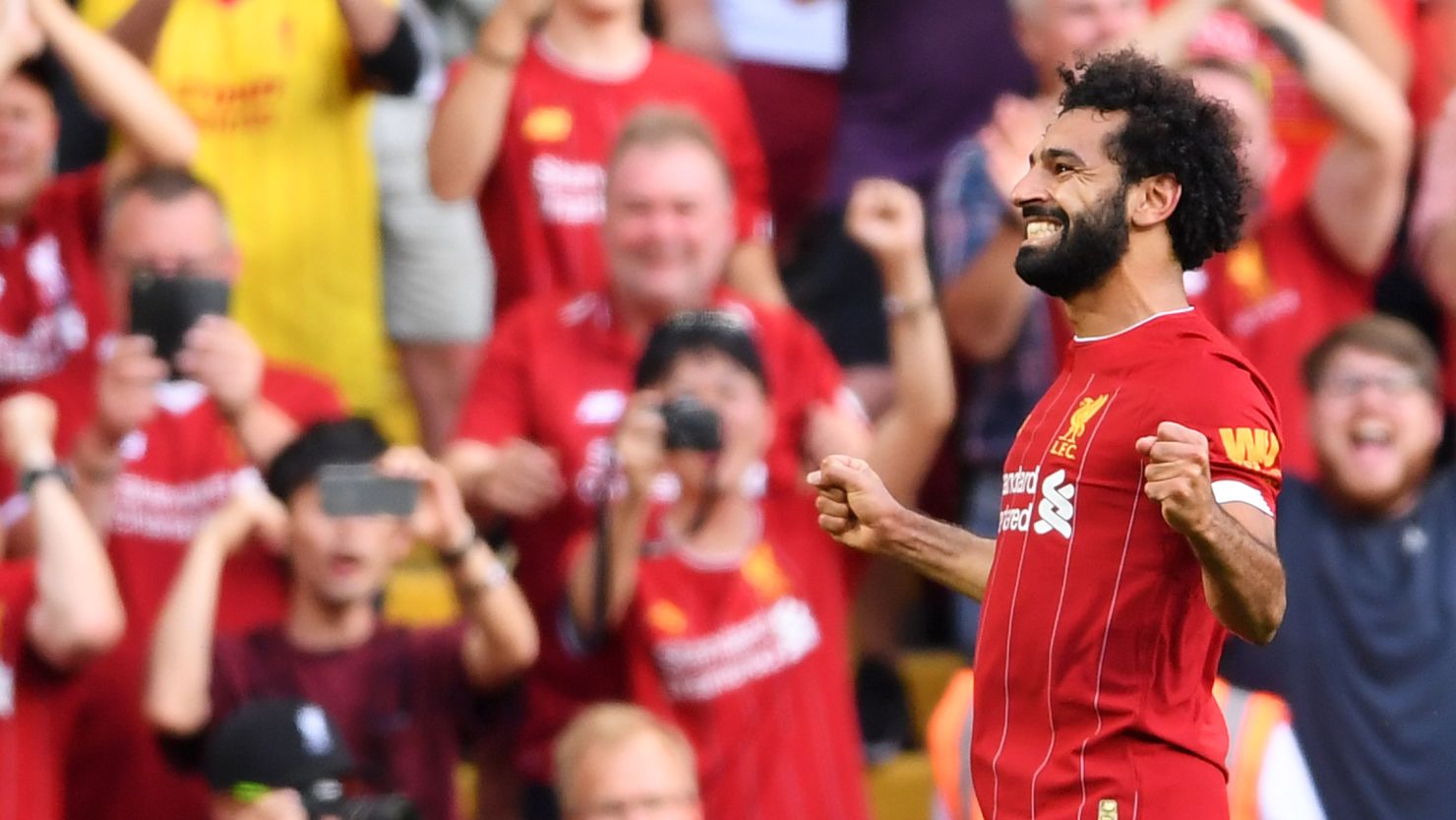 Mohamed Salah scored twice against Arsenal to move Liverpool top of the table