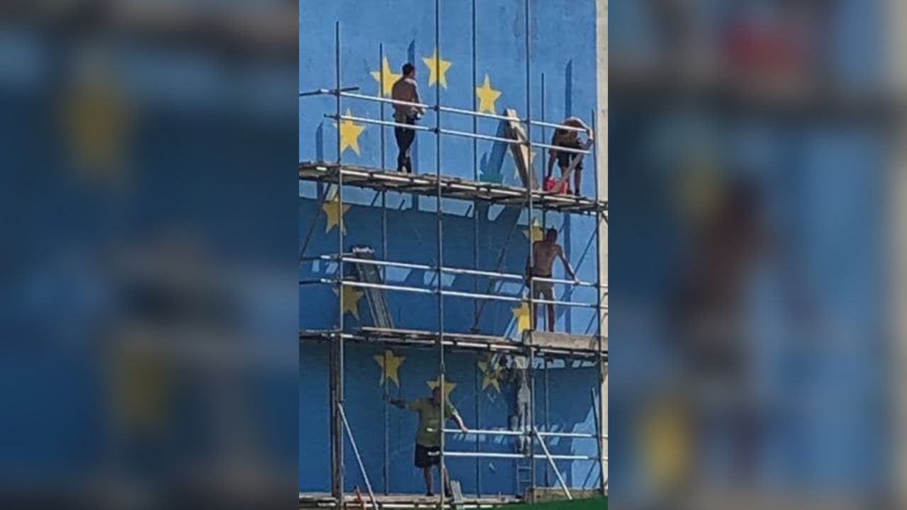 On Saturday, scaffolding was erected beside the mural.