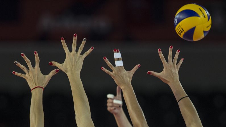 Players attempt to block a shot in a match between Turkey and Greece during the group stages of the Women's European Volleyball Championship in Ankara, Turkey, on August 23.