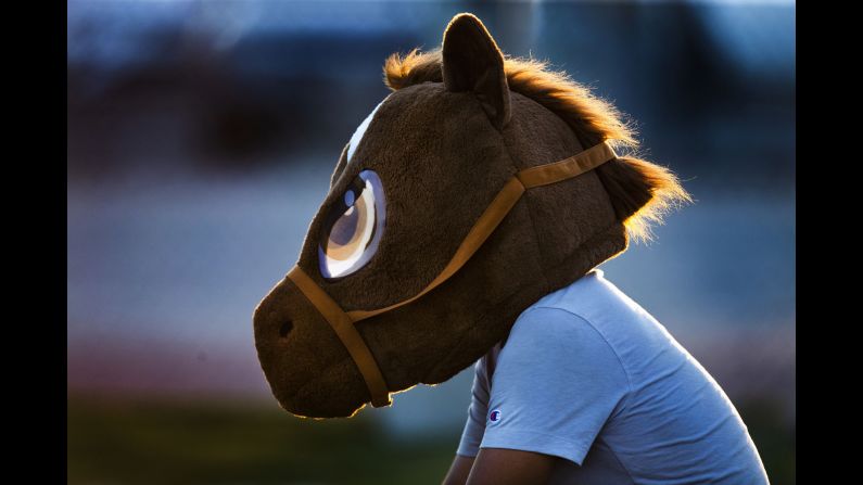 Atletico de Madrid club assistant coach Issac Rosales wears the team mascot horse head as he watches the 15 and over female club team during practice in San Bernardino, California, on Monday, August 19. <a href="index.php?page=&url=https%3A%2F%2Fwww.cnn.com%2F2019%2F08%2F18%2Fsport%2Fgallery%2Fwhat-a-shot-sports-0819%2Findex.html" target="_blank">See 26 sports photos from last week.</a>