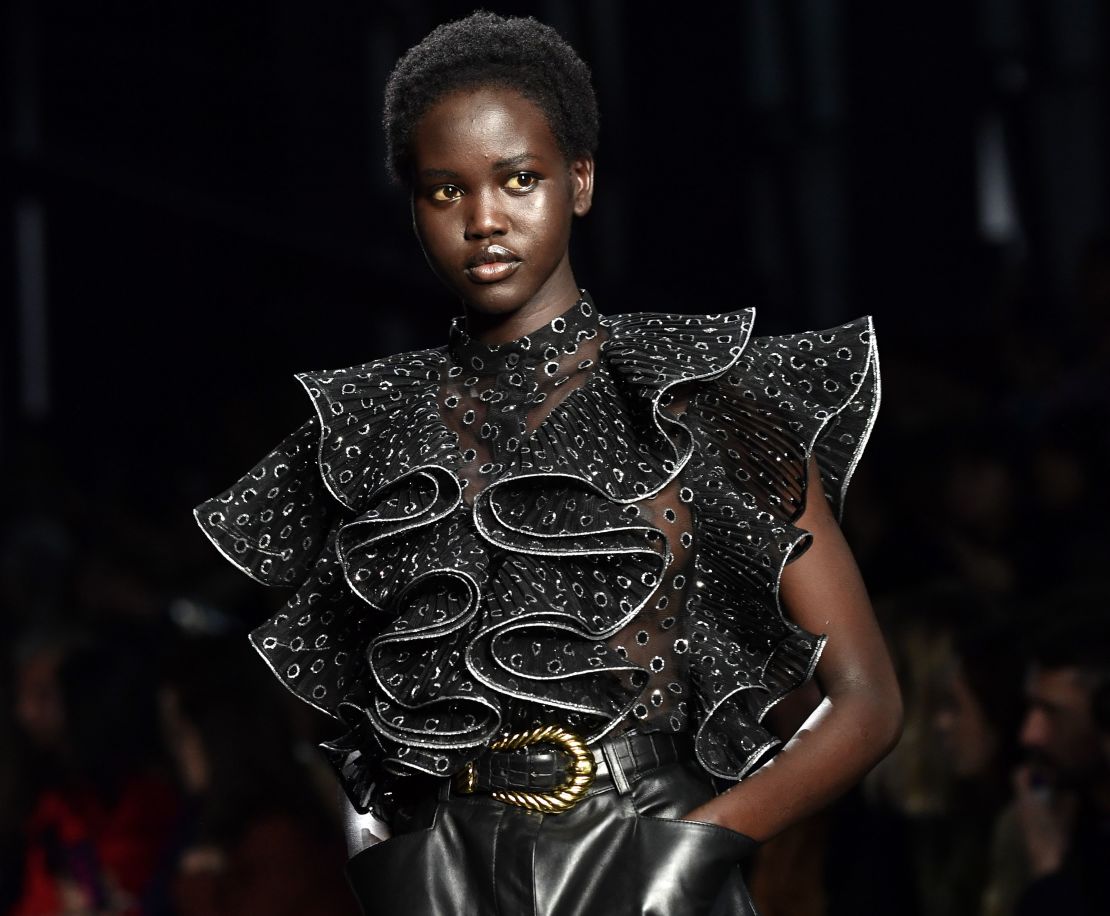 Model Adut Akech presents a creation during the Alberta Ferretti women's Fall/Winter 2019/2020 collection fashion show, on February 20, 2019 in Milan.