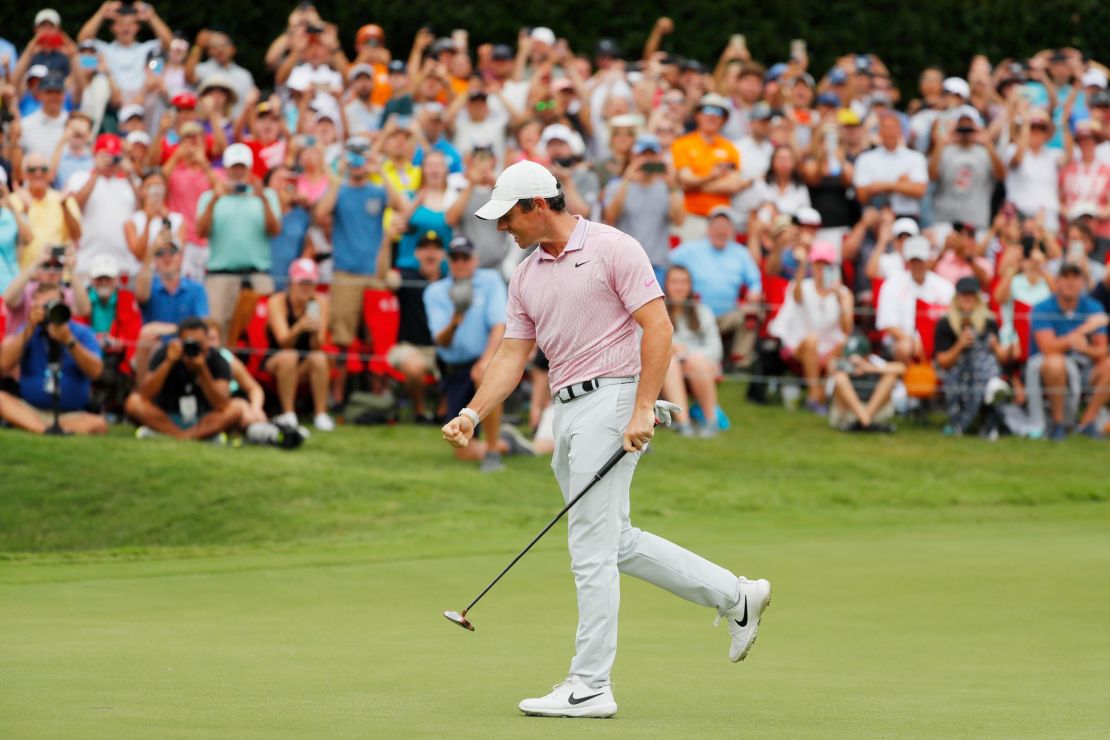 McIlroy celebrates after winning on the 18th green during the Tour Championship.