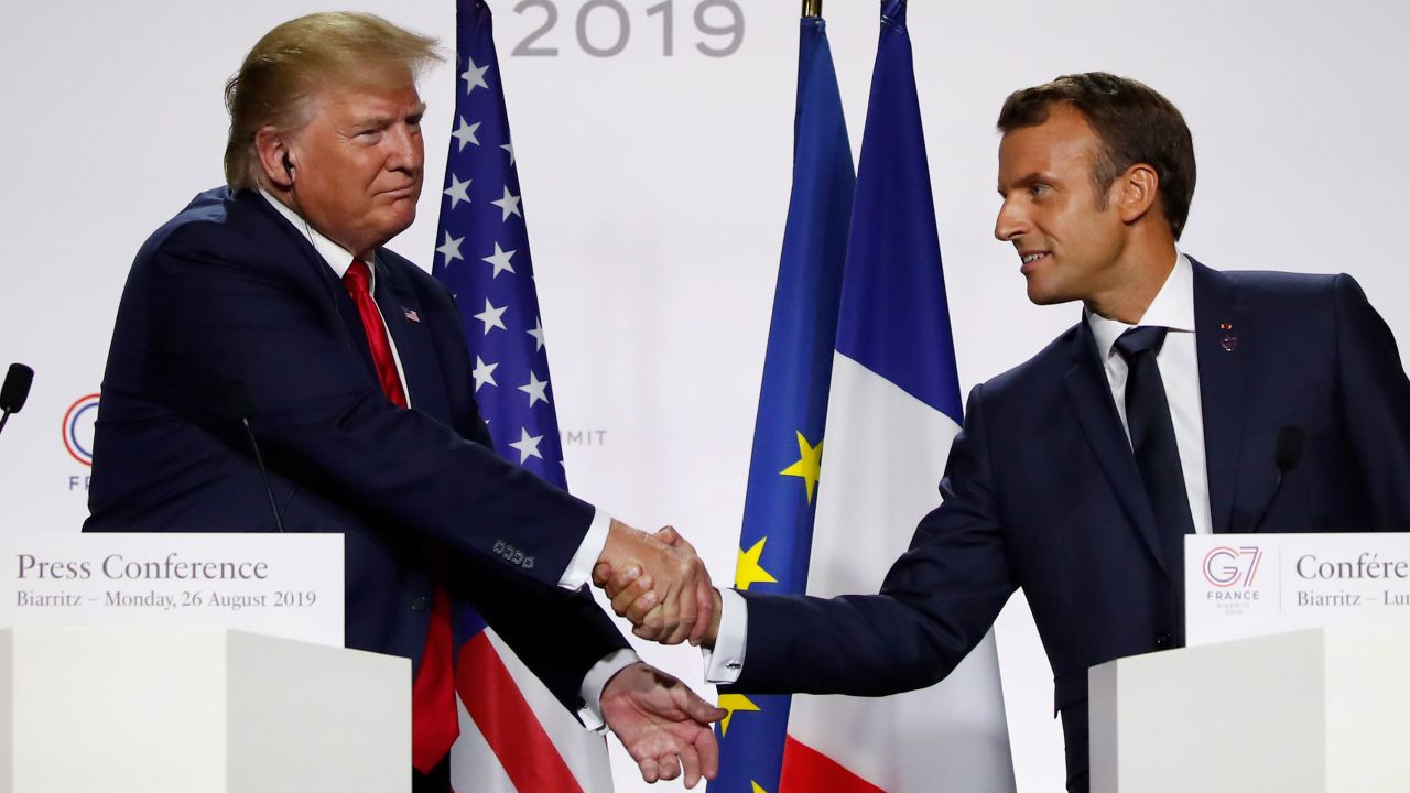 French President Emmanuel Macron, right, and US President Donald Trump shake hands during the final press conference during the G7 summit Monday.