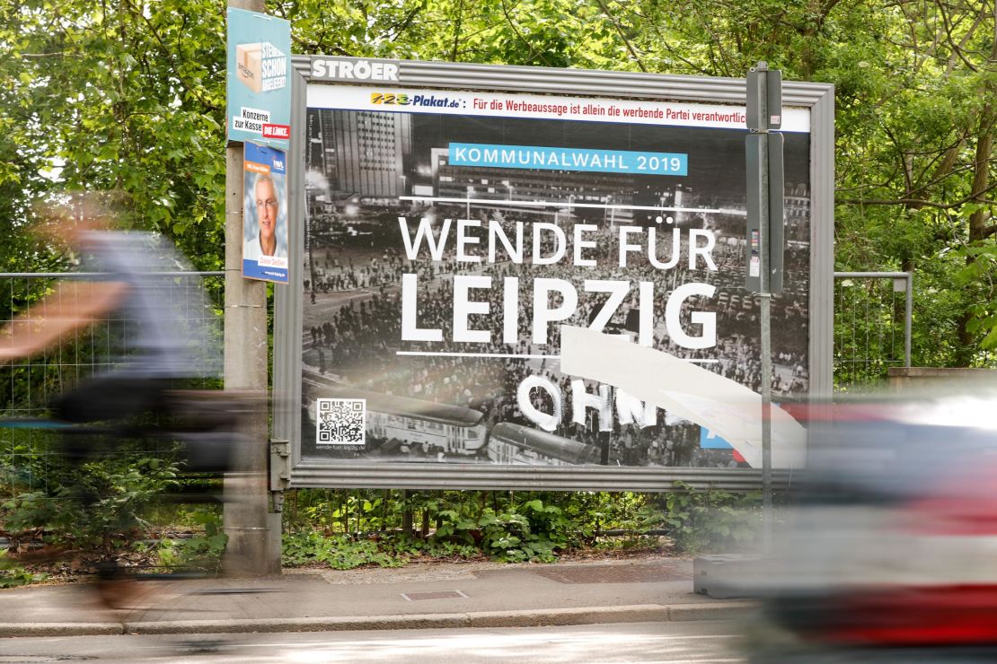 An AfD billboard with a photo of the 1989 Leipzig protests taken by Martin Neuhof's grandfather.
