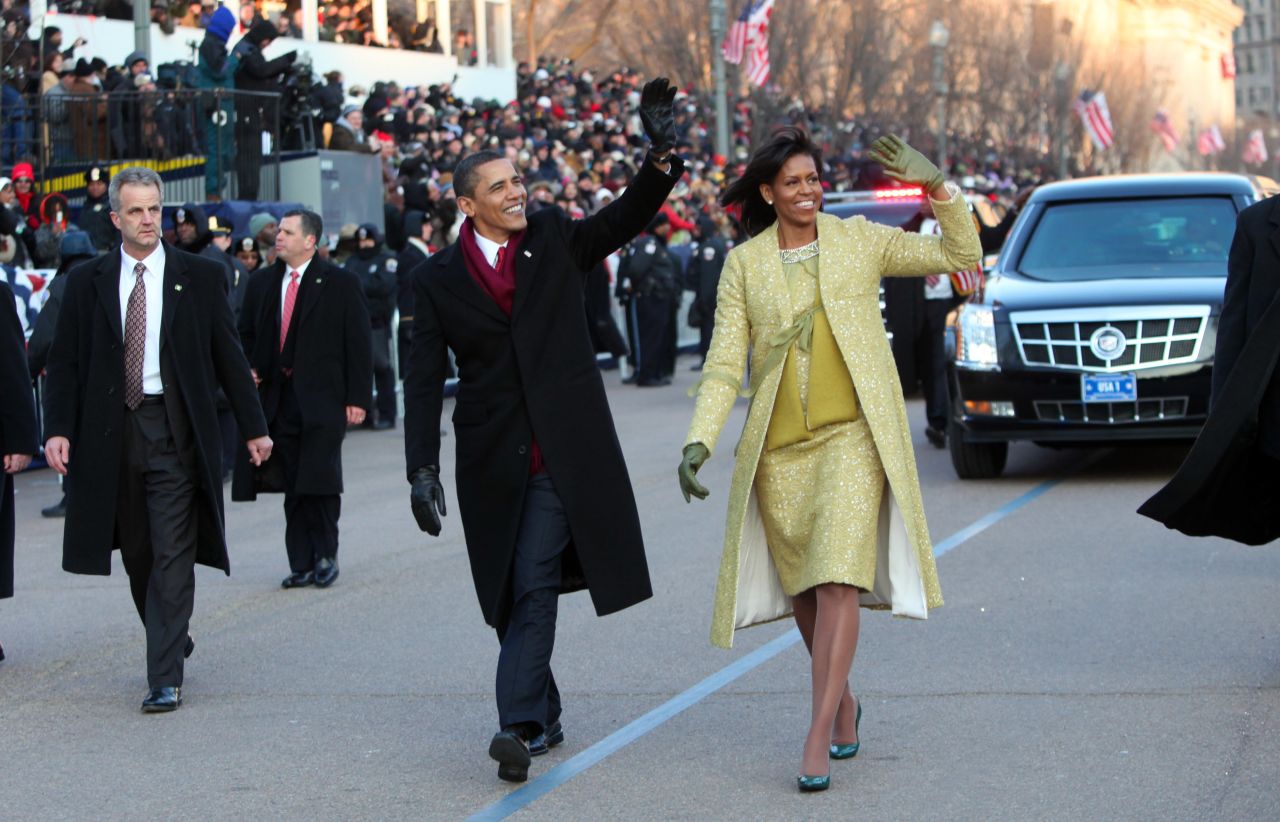 Michelle Obama wore a lemongrass shift and matching overcoat designed by Isabel Toledo to the 2009 inauguration in Washington, DC.