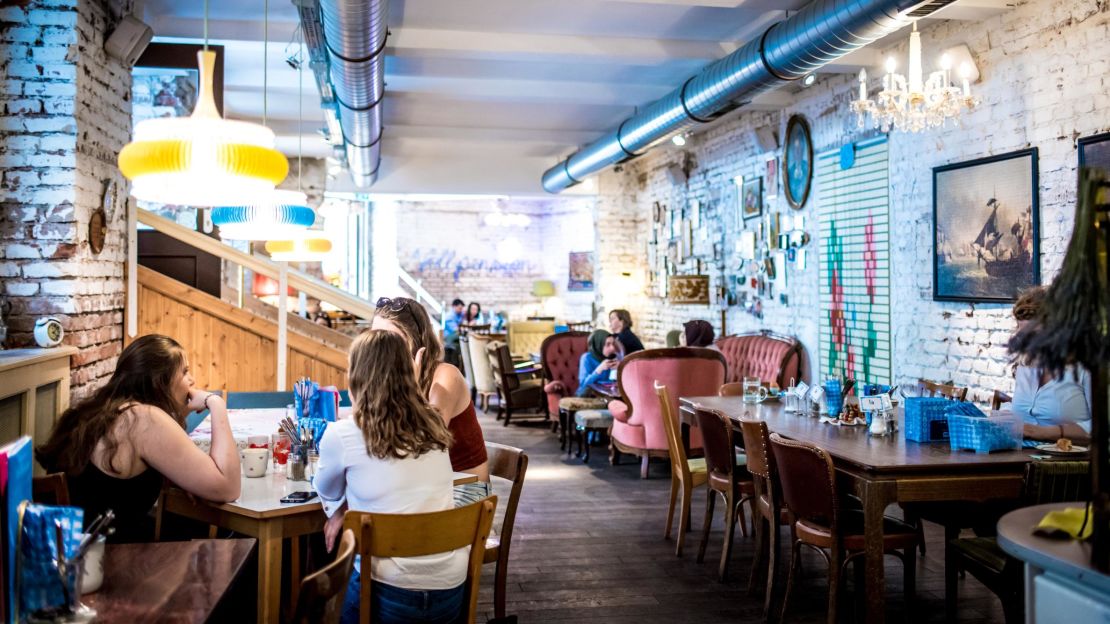 The cafe is filled with worn but inviting furniture, lace doilies, tiny vases and cute figurines.