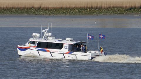 The Hydroville sailing on the Scheldt river in Belgium, with employees of Compagnie Belge Maritime on board. 