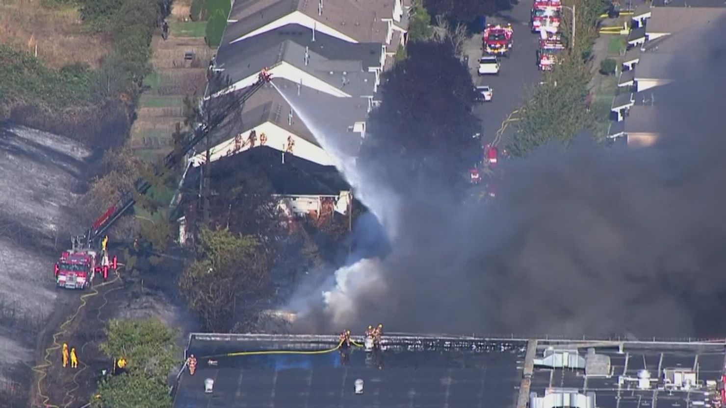 Firefighters battle flames in the Madison South neighborhood of Portland, Oregon.