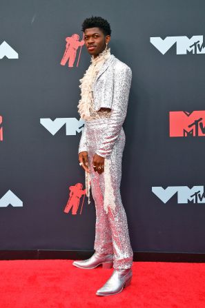 Lil Nas X channeled his inner matador in a cropped sequined suit jacket and cowboy boots.