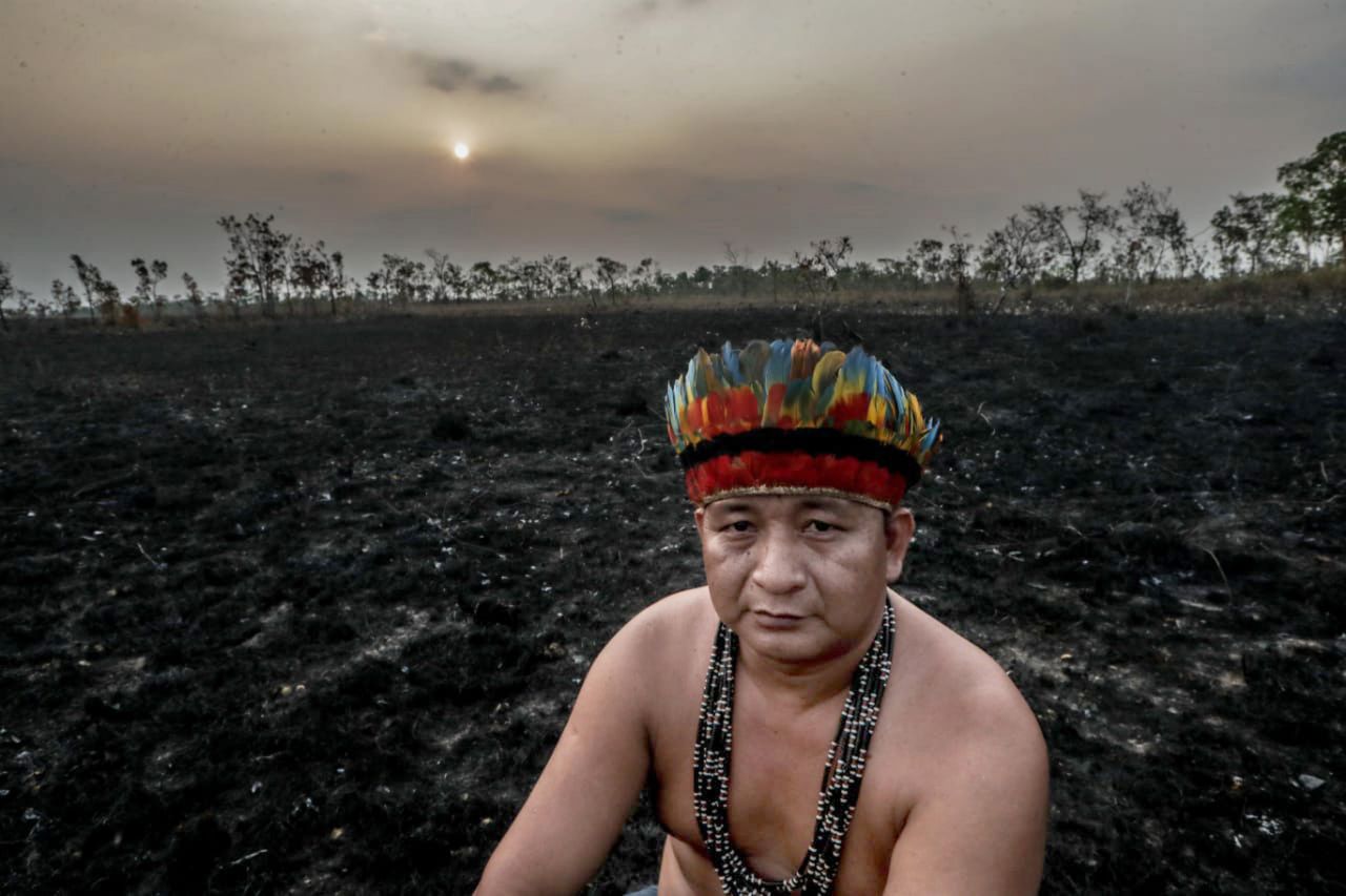 Indigenous leader Antonio Enésio Tenharin is photographed in a burned area of Brazil's Manicoré region.
