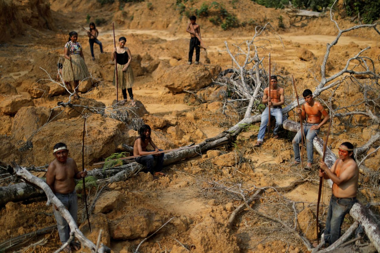 Indigenous people from the Mura tribe show a deforested area near Humaitá on Tuesday, August 20.