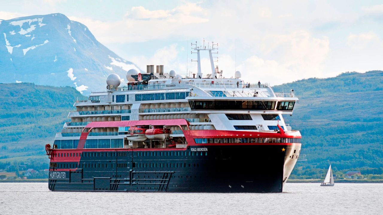 The MS Roald Amundsen, the first hybrid cruise ship in Hurtigruten's fleet, arrives in Tromso, northern Norway on July 3, 2019.