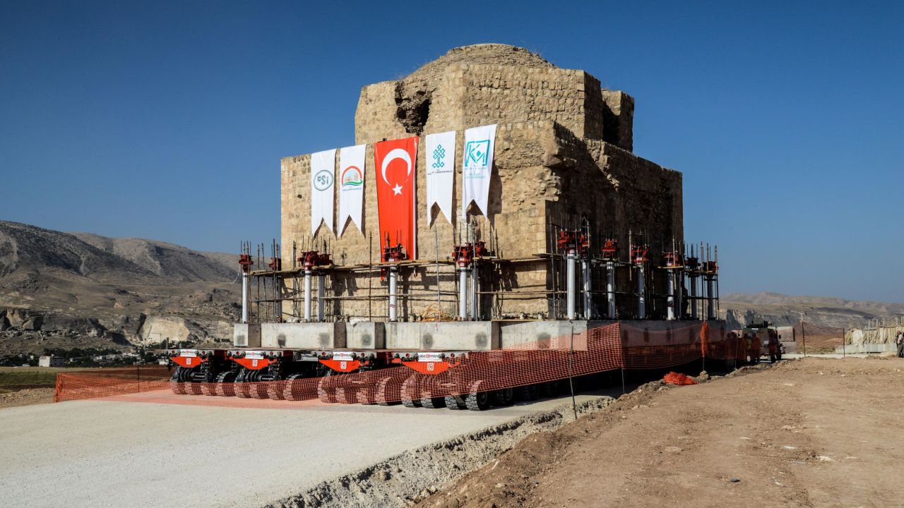 The Artuklu Hamam, a centuries-old bath house weighing 1,600 tonnes, is loaded onto a wheeled platform and moved down a specially constructed road in 2018 as part of preparations.
