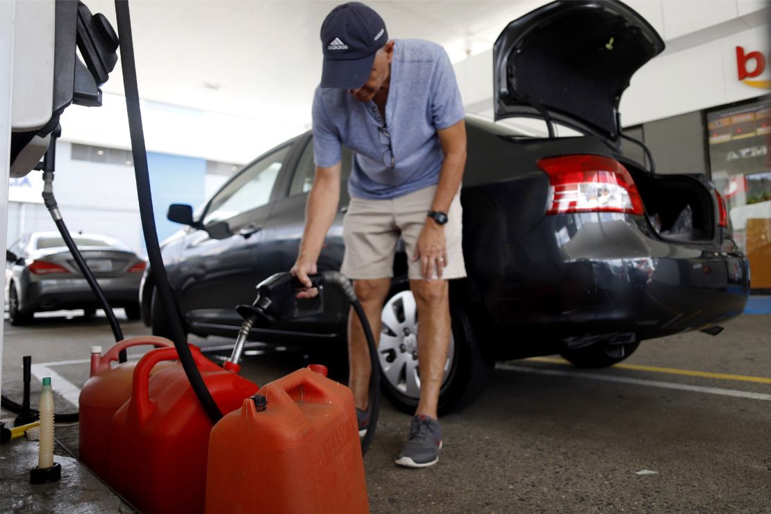 People were stocking up on gasoline, water and other supplies Tuesday in Ponce, Puerto Rico.