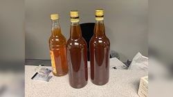 Evidence: three bottles of honey.