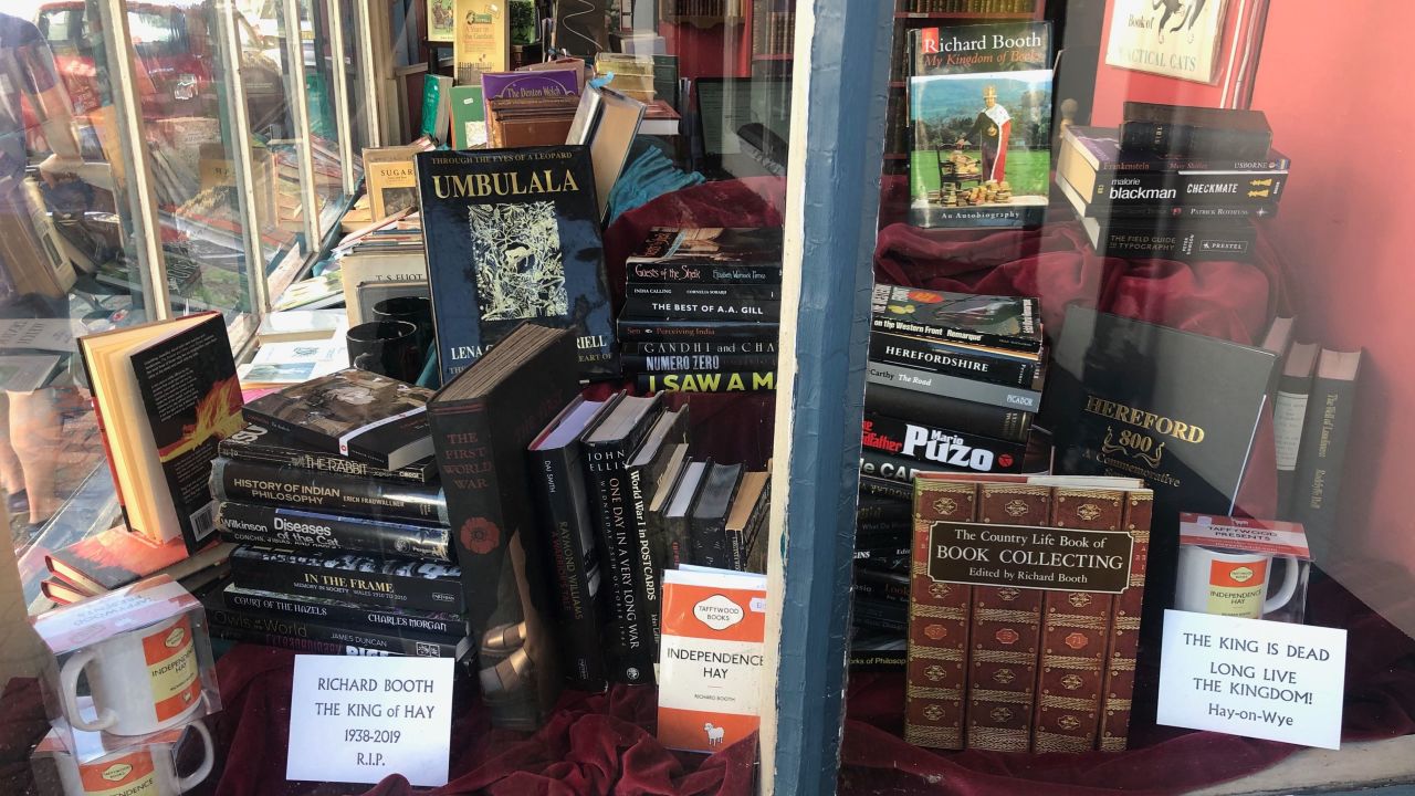 Several shop fronts leave signs and notices in honor of Richard Booth, who died in August 2019.