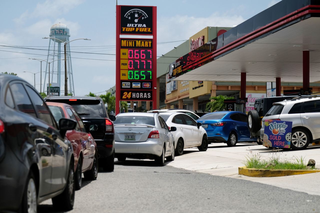 Cars line up for fuel at a gas station in Mayaguez, Puerto Rico, on Tuesday, August 27.