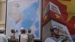 Men look at an official map of Vietnam as they visit an exhibition on archipelagos Truong Sa (Spratlys) and Hoang Sa (Paracels) at the Army Museum in Hanoi on July 10, 2013. Vietnamese authorities have recently intensified propaganda on its sovereignty of the Spratlys and Paracels islands in the South China Sea currently claimed by Vietnam, China, Taiwan, Philippines and Malaysia.  AFP PHOTO/HOANG DINH Nam / AFP / HOANG DINH NAM        (Photo credit should read HOANG DINH NAM/AFP/Getty Images)
