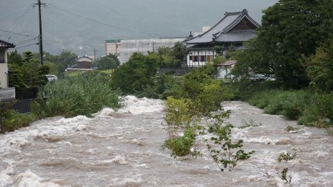 Rising water caused by heavy rain is seen at Muromi river in Fukuoka on August 28, 2019.