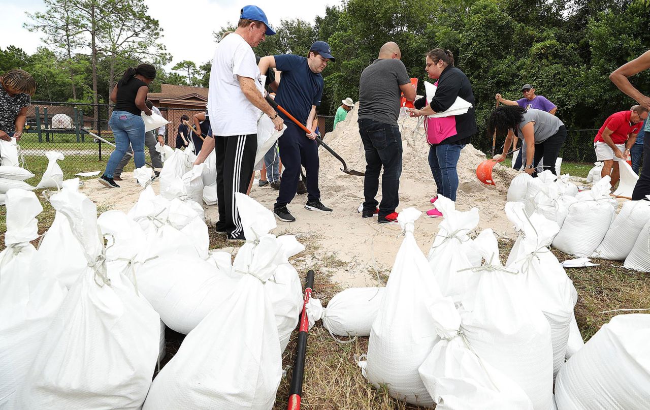 Dozens of Orange County residents fill sandbags at Blanchard Park in Orlando on Wednesday, August 28.