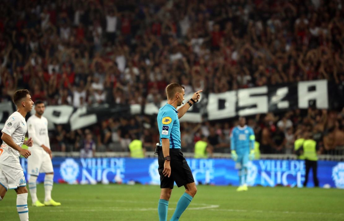 French referee Clement Turpin halts the game in Nice Wednesday.