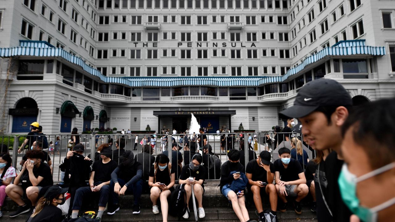 Protesters gathering in front of The Peninsula in Hong Kong. The hotel declined to comment on whether its business had been affected by a recent slowdown in the hospitality industry.
