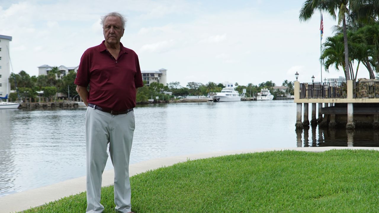 Guus van Kesteren stands overlooking the Intracoastal Waterway in Delray Beach, which he says has flooded his back yard several times in recent years.
