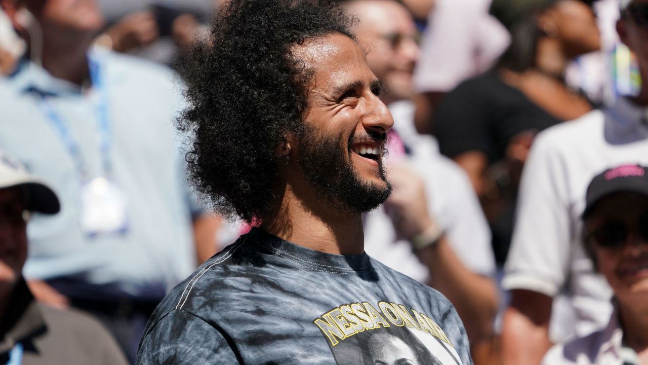 Colin Kaepernick watches Naomi Osaka's match against Magda Linette at Louis Armstrong Stadium on Thursday.