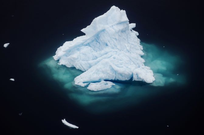 An iceberg floats in a fjord near the town of Tasiilaq, Greenland, in June 2018. Greenland is often considered by scientists to be <a href="index.php?page=&url=https%3A%2F%2Fwww.cnn.com%2Finteractive%2F2018%2F09%2Fworld%2Fgreenland-climate-change-cnnphotos%2F" target="_blank">ground zero of the Earth's climate change.</a> The massive island is mostly in the Arctic, which is warming twice as fast as the rest of the planet. Melting ice from Greenland's ice sheet is the largest contributor of all land sources to the rising sea levels that could become catastrophic for coastal cities around the world. "Seeing the size of these icebergs in the water was like looking at entire city blocks floating around," Reuters photographer <a href="index.php?page=&url=https%3A%2F%2Fwiderimage.reuters.com%2Fphotographer%2Flucas-jackson" target="_blank" target="_blank">Lucas Jackson</a> said.