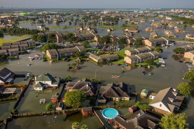 A neighborhood is flooded in Beaumont, Texas, a day after <a href="index.php?page=&url=https%3A%2F%2Fwww.cnn.com%2F2017%2F08%2F26%2Fus%2Fgallery%2Fhurricane-harvey%2Findex.html" target="_blank">Hurricane Harvey</a> came ashore in August 2017. The Category 4 storm caused historic flooding. It set a record for the most rainfall from a tropical cyclone in the continental United States, with 51 inches of rain recorded in areas of Texas. An estimated 27 trillion gallons of water fell over Texas and Louisiana during a six-day period. "Warmer sea water from our changing climate is causing tropical storms to be more wet and powerful," photographer <a href="index.php?page=&url=https%3A%2F%2Fgeorgesteinmetz.com%2F" target="_blank" target="_blank">George Steinmetz</a> said.