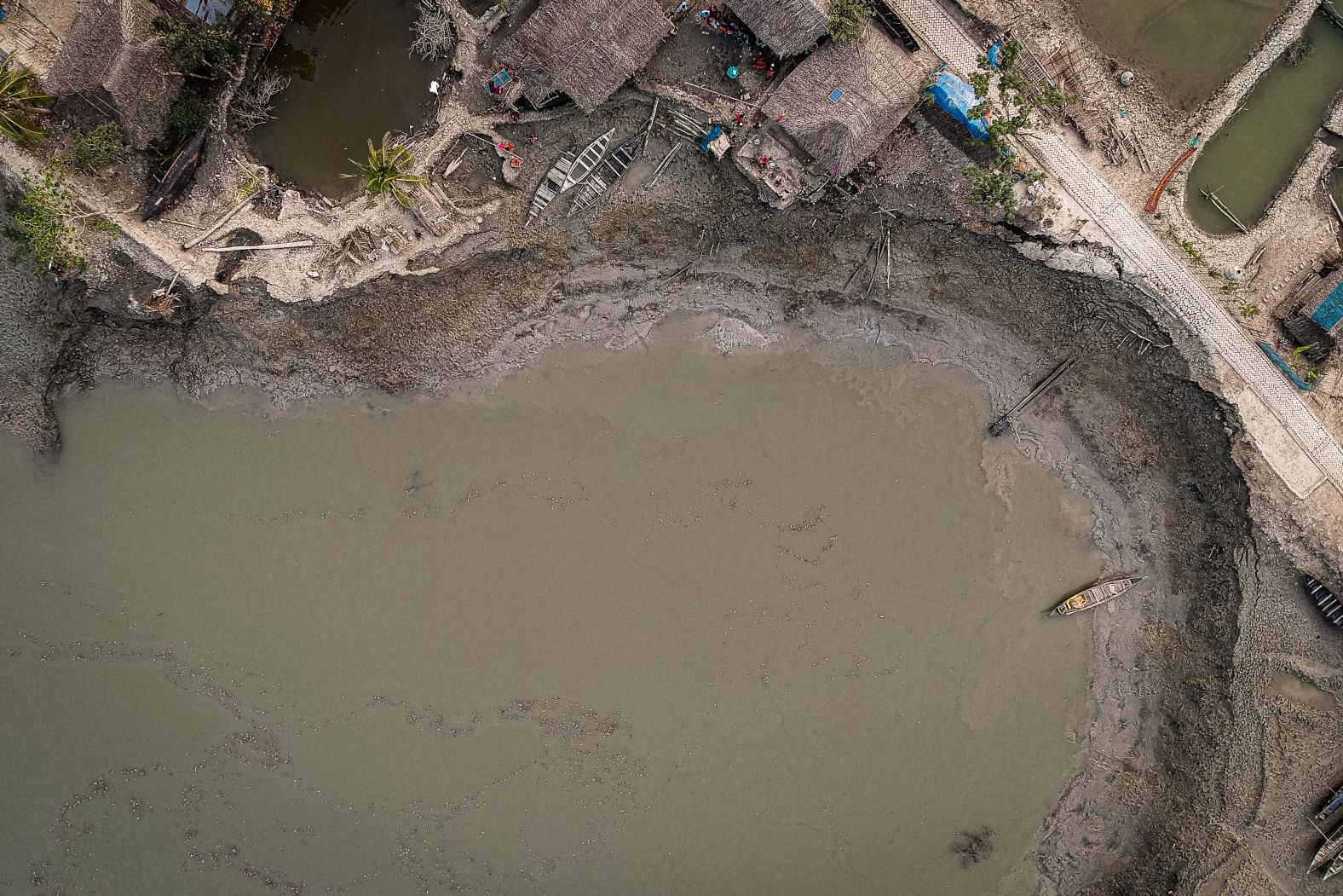 Bangladesh was recently ranked by research firm Maplecroft as the country <a href="index.php?page=&url=https%3A%2F%2Fwww.cnn.com%2F2013%2F10%2F29%2Fworld%2Fgallery%2Fclimate-change-index%2Findex.html" target="_blank">most vulnerable to climate change,</a> due to its exposure to threats such as flooding, rising sea levels, cyclones and landslides as well as its susceptible population and weak institutional capacity to address the problem. This aerial photo, taken by <a href="index.php?page=&url=http%3A%2F%2Fwww.ignacio-marin.com%2F" target="_blank" target="_blank">Ignacio Marin,</a> shows where some homes used to be before the river washed them away. "From where I was standing, at the riverbank, it was hard to imagine that there were nine houses where I could only see water," Marin said. "So I decided to fly the drone. Only then, watching the area from above, I realized the scale of the disaster."