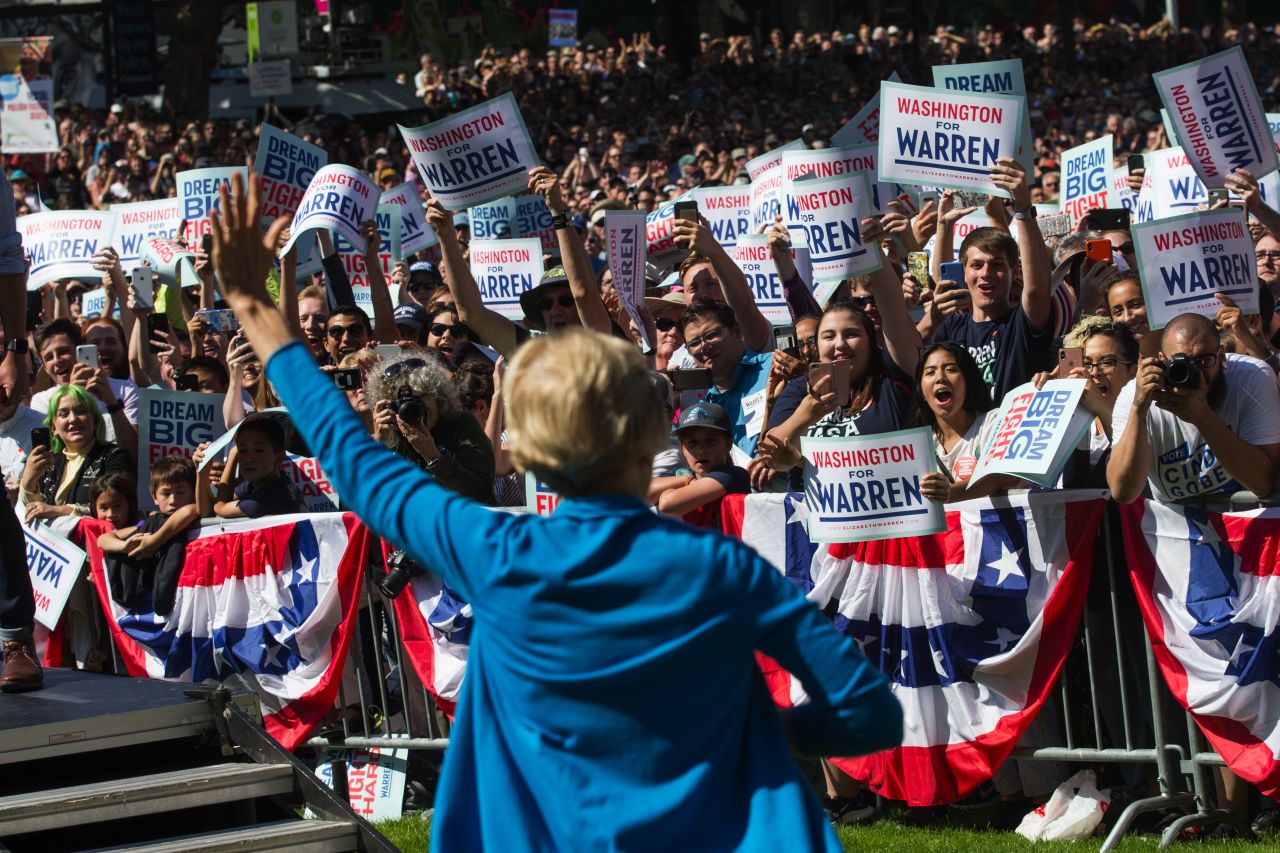 US Senator and presidential candidate Elizabeth Warren waves to supporters during a campaign rally in Seattle on August 25.