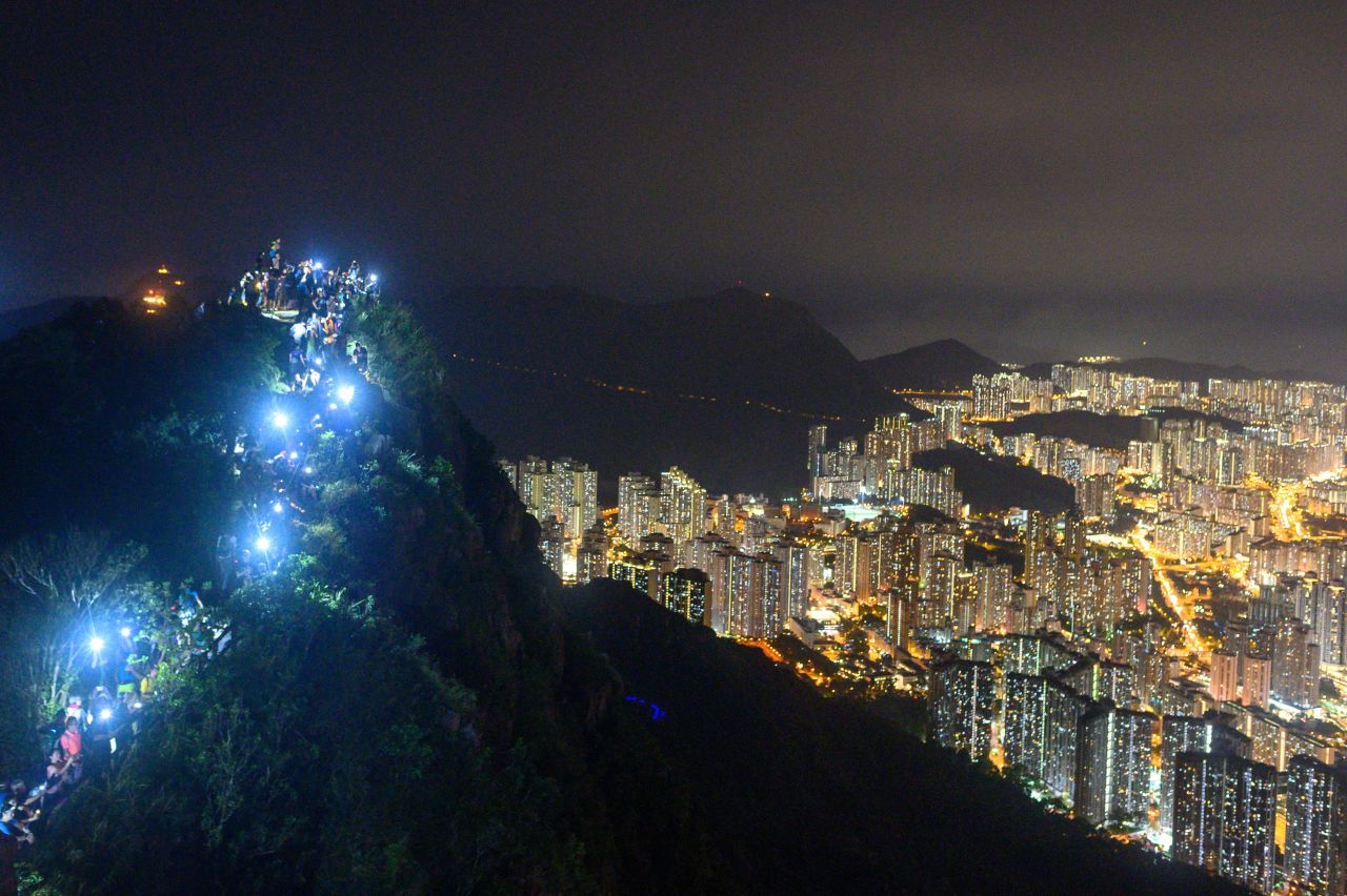 <a href="https://www.cnn.com/2019/06/09/world/gallery/hong-kong-extradition-protest/index.html" target="_blank">Protesters</a> shine light from their cell phones as they form a human chain on top of the iconic Lion Rock at Wong Tai Sin in Hong Kong on August 23. The <a href="https://www.cnn.com/2019/08/23/asia/hong-kong-human-chain-intl-hnk/index.html" target="_blank">human chain</a> was planned to coincide with the 30th anniversary of the "Baltic Way," a historically significant peaceful demonstration against Soviet occupation.
