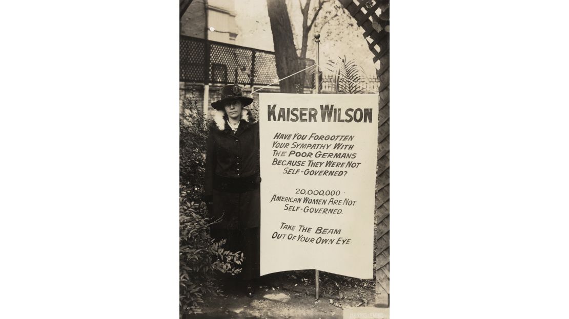 Virginia Arnold holding Kaiser Wilson banner in 1917
