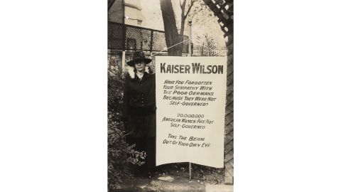 Virginia Arnold holding Kaiser Wilson banner in 1917 