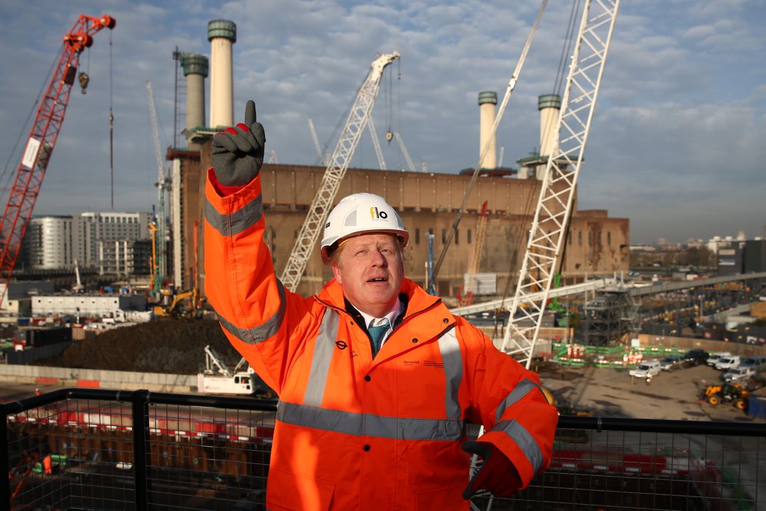 Boris Johnson poses to mark the start of works to build London Underground's Northern line extension.