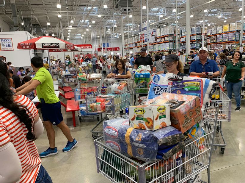 Shoppers wait in long lines at a Costco in Davie, Florida, on August 29.