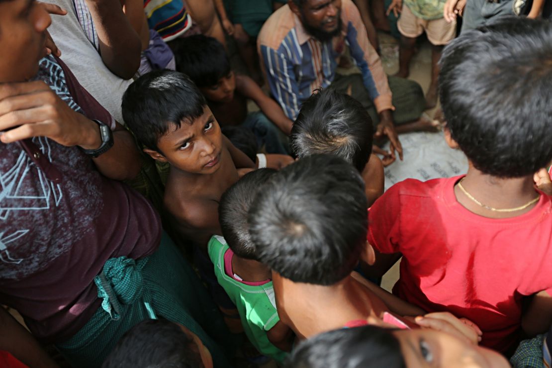 A Rohingya boy looks into the camera. According to the UN migration agency, men and boys account for about a third of Rohingya  forced into labor.