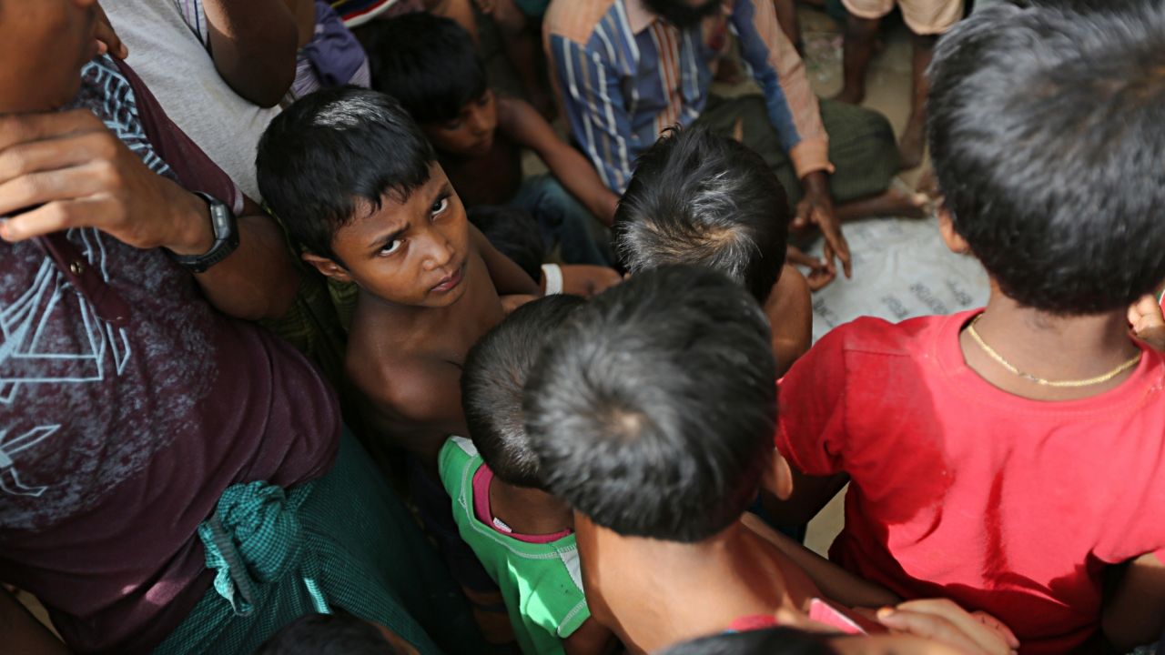 A Rohingya boy looks into the camera. According to the UN migration agency, men and boys account for about a third of Rohingya  forced into labor.