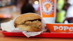 A chicken sandwich is seen at a Popeyes, Thursday, Aug. 22, 2019, in Kyle, Texas. After Popeyes added a crispy chicken sandwich to their fast-fast menu, the hierarchy of chicken sandwiches in America was rattled, and the supremacy of Chick-fil-A and others was threatened. It's been a trending topic on social media, fans have weighed in with YouTube analyses and memes, and some have reported long lines just to get a taste of the new sandwich. (AP Photo/Eric Gay)