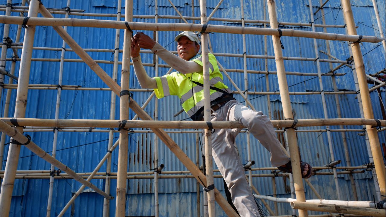 Macao's humid summers and tightly-packed buildings produce challenging conditions for the territory's remaining bamboo scaffolders.